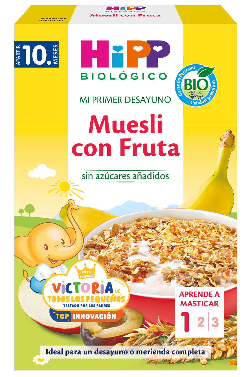 Una caja amarilla muestra un elefante de dibujos animados, un bol de muesli, un plátano y una ciruela, con un texto que indica que es un producto para bebés a partir de 10 meses, etiquetado como ecológico y adecuado para la etapa 1