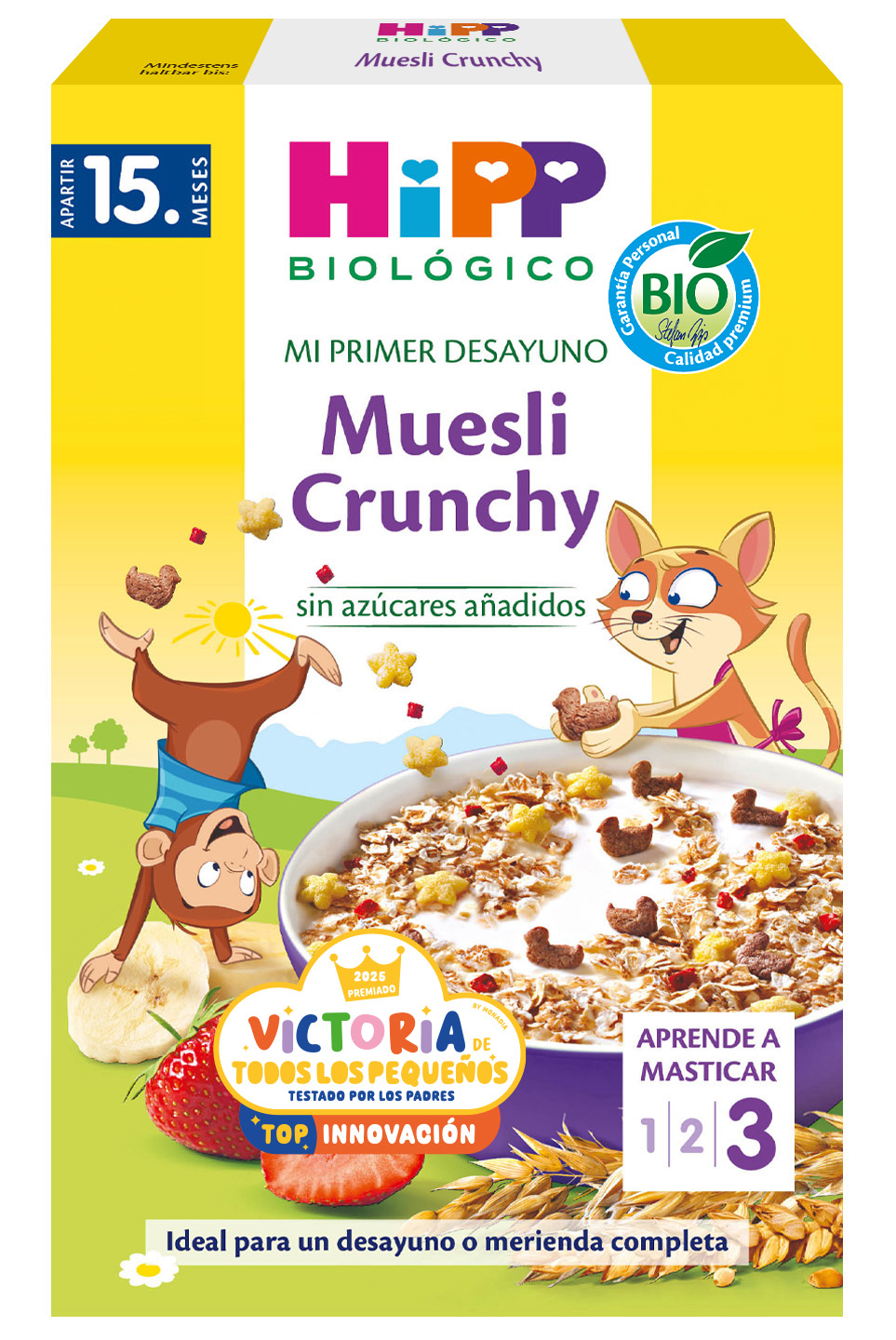 Una caja amarilla muestra un elefante de dibujos animados, un bol de muesli, un plátano y una ciruela, con un texto que indica que es un producto para bebés a partir de 10 meses, etiquetado como ecológico y adecuado para la etapa 3